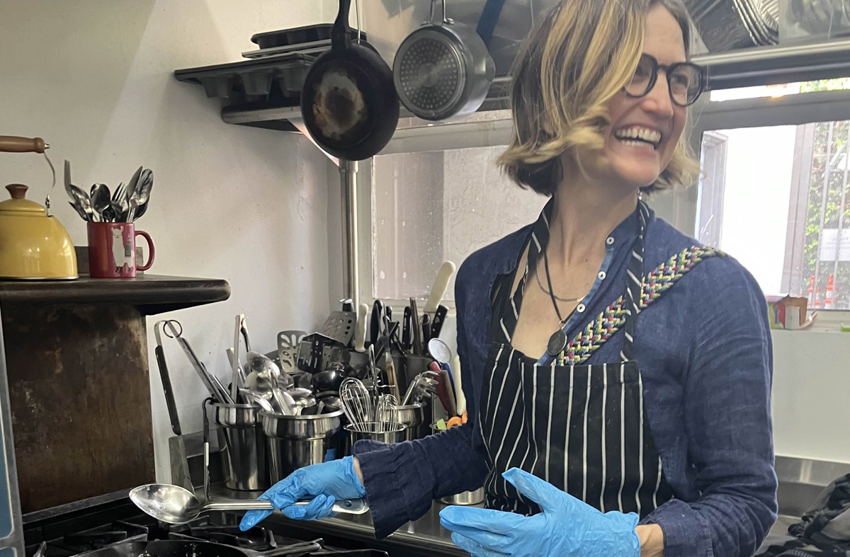 Volunteer joyfully cooking