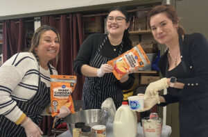 Cheerful volunteers in the kitchen