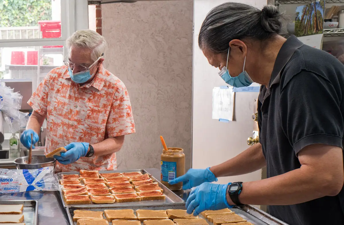 Volunteers making sandwiches
